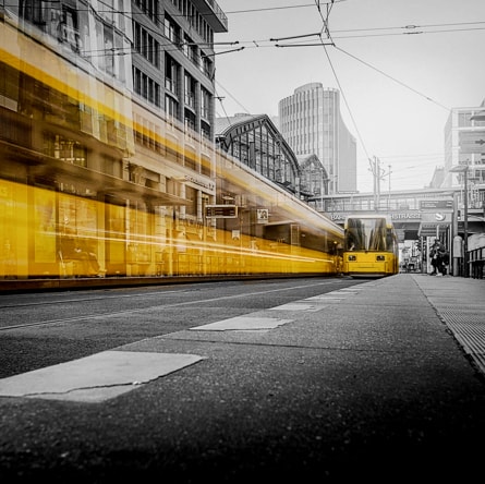 People boarding a train in the city.